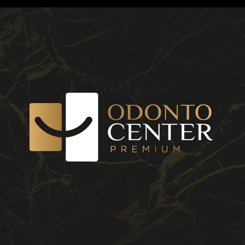 Logotipo Odonto Center Premium, em dourado e branco sobre mármore preto